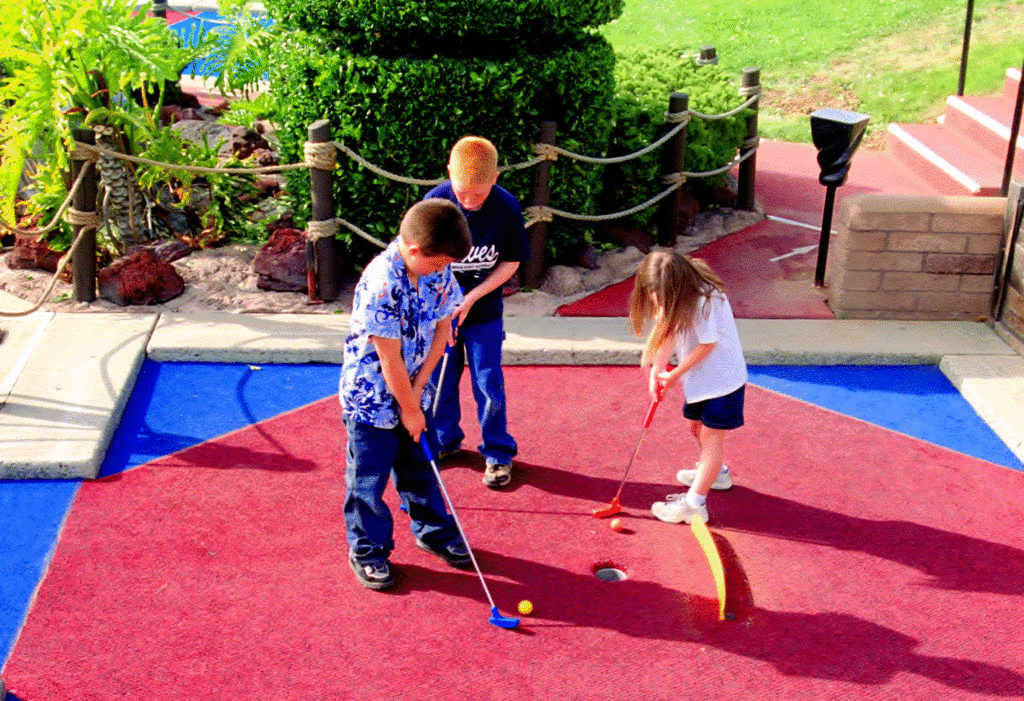kids playing mini golf at school fundraiser